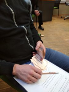 Playing cards or practical exercises in the nonviolent communication method training. Photo: Linda Blättler
